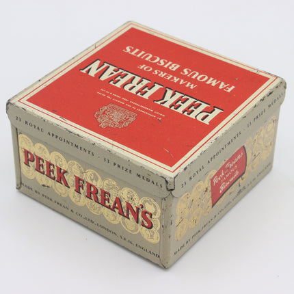 Vintage Peek Frean's Biscuits tin box, showing the red and gold packaging with white lettering on a clean white background.