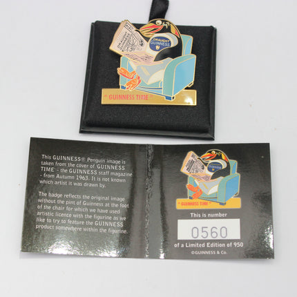 Guinness-themed penguin pin with packaging on a white background