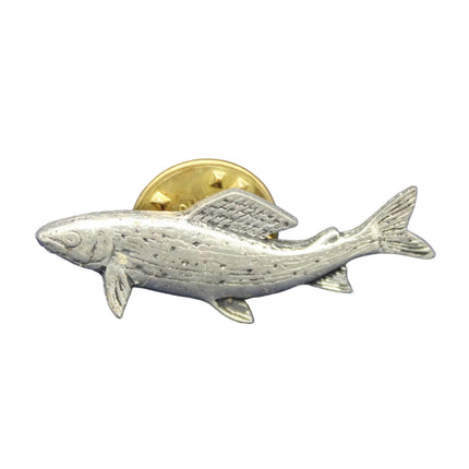 Metallic fish-shaped object on a blue textured background