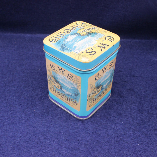 CWS Biscuits tin on a blue background