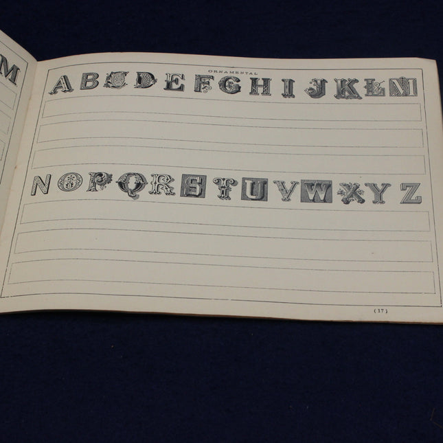 Sheet of paper with decorative letters and numbers on a dark background