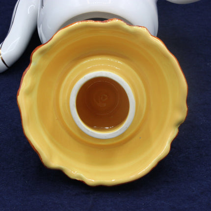 Yellow ceramic bowl on a blue background