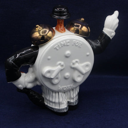 Decorative teapot with a face, arms, and legs on a dark background