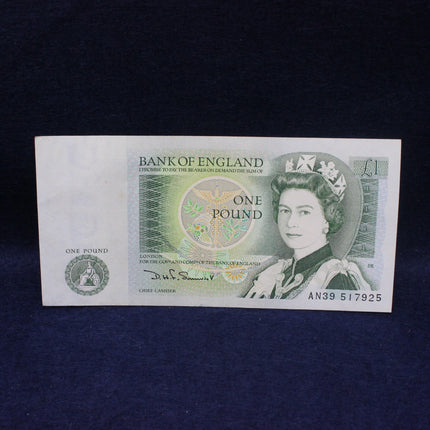 One pound banknote from the Bank of England on a dark background