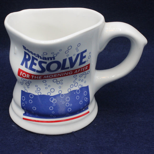 White ceramic mug with 'Resolve' branding on a dark blue background