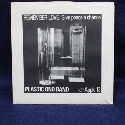 Album cover for 'Remember Love / Give Peace a Chance' by Plastic Ono Band with black and white design.