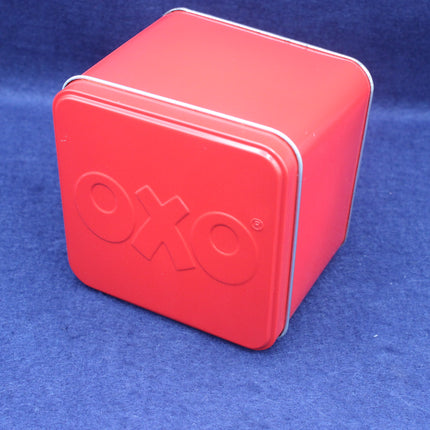 Red OXO tin box on a blue background