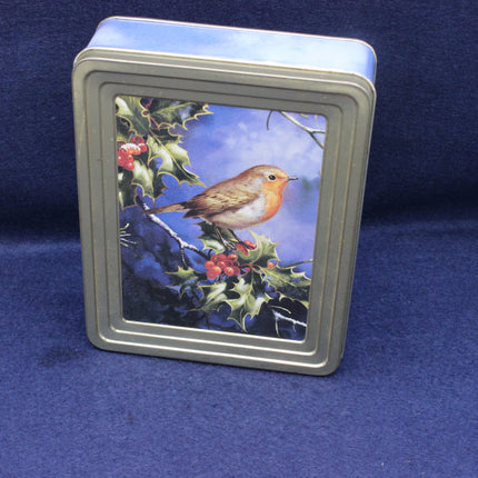 Metallic tin with a robin and holly design on a blue background