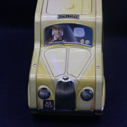 Toy car with a figure inside on a dark background