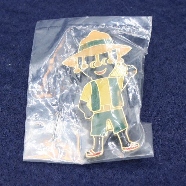 Robertson’s 1994 Australian Golly Badge in a clear packet on a dark blue background.