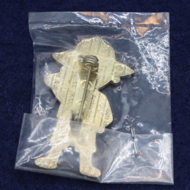 Rear view of a Robertson’s 1994 Australian Golly Badge in a clear packet on a dark blue background.