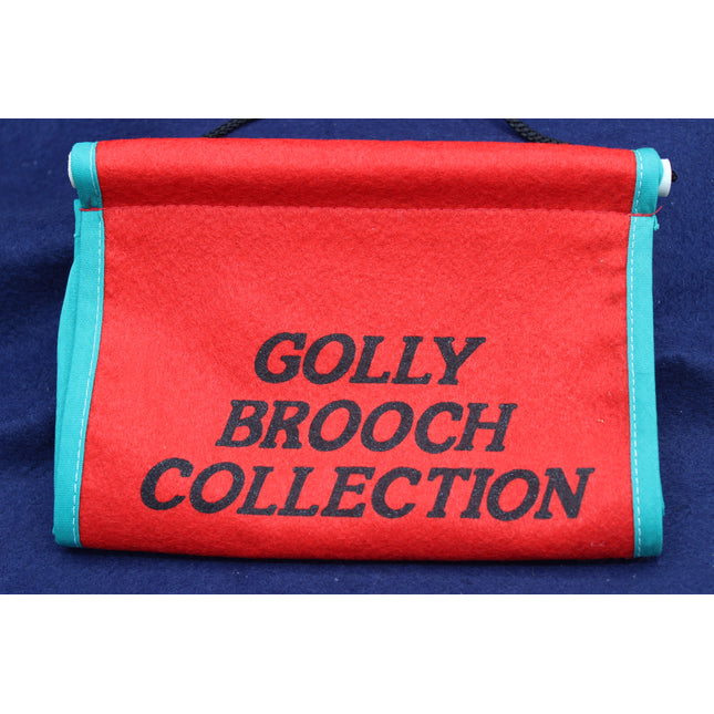 Red scroll with 'Golly Brooch Collection' text on a blue background