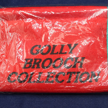 Red package with 'Golly Brooch Collection' text on a blue background