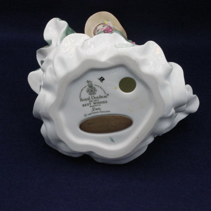 Back view of a ceramic figurine with 'Royal Doulton' branding on a dark background