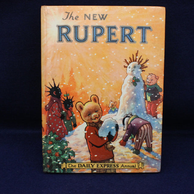 Vintage book cover of 'The New Rupert' featuring cartoon characters around a snowman.