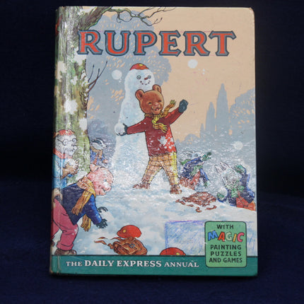 Rupert Annual book cover with a bear in a snowy scene