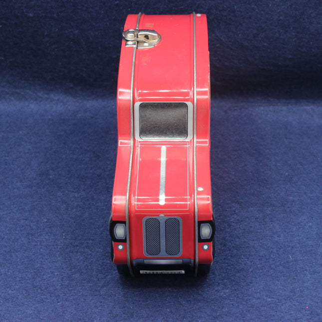 Red toy car model on a blue background
