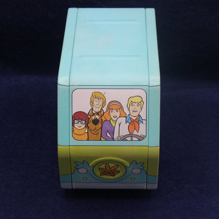 Cartoon character-themed pencil sharpener on a dark background