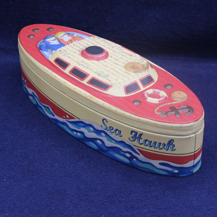 Toy boat model with 'Sea Hawk' branding on a blue background