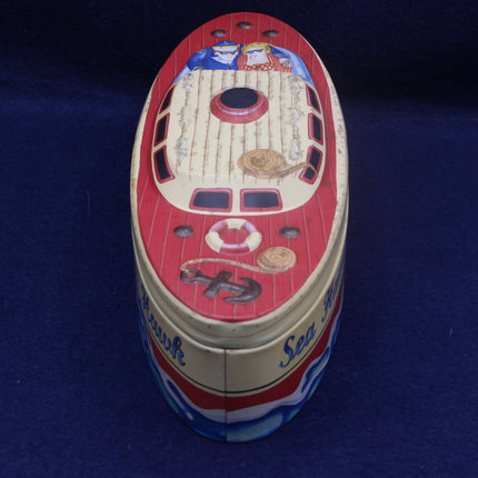Decorative tin can with ship design on a blue background
