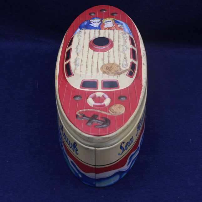 Decorative tin can with ship design on a blue background