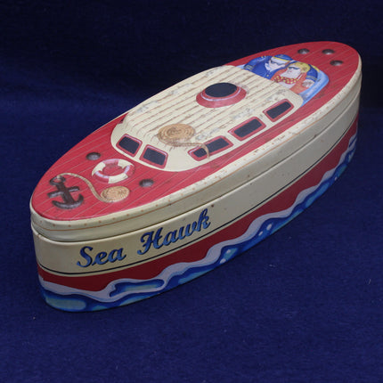 Toy boat model with 'Sea Hawk' branding on a blue background
