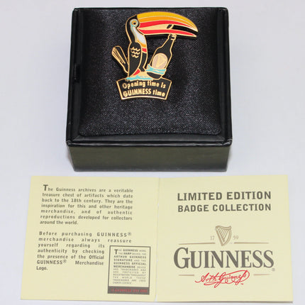 Guinness badge with toucan design in a black box with a yellow card