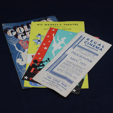 Collection of vintage cinema and theater programs on a dark background