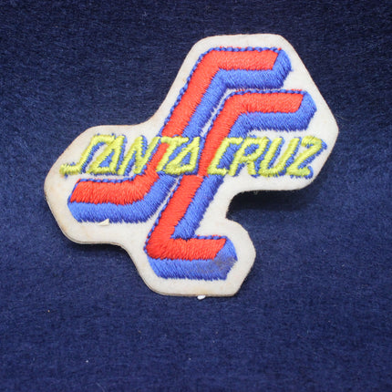 Embroidered patch with 'Santa Cruz' text on a blue fabric background