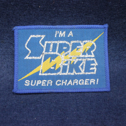Embroidered patch with 'I'm a Super Like Super Charger!' text on a blue background
