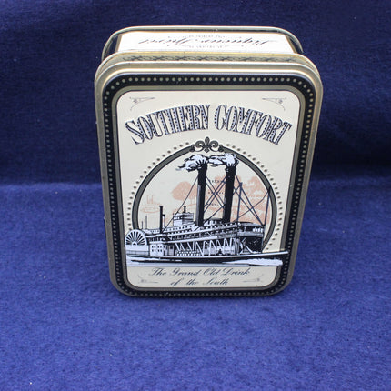 Southern Comfort tin box on a blue background