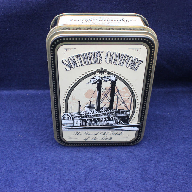 Southern Comfort tin box on a blue background
