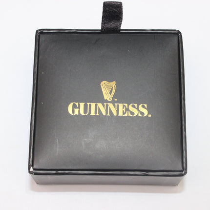 Black box with gold 'Guinness' logo on a white background