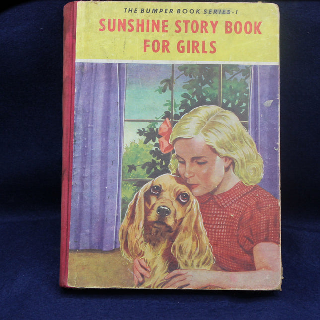 Vintage book titled 'Sunshine Story Book for Girls' with a girl and dog illustration on a blue background