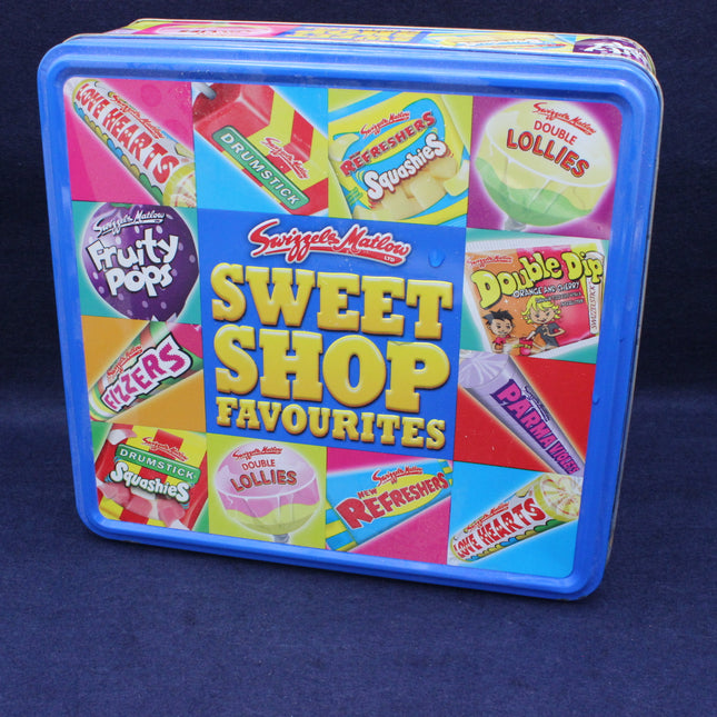 Tin box of Swizzles Sweet Shop Favourites on a dark blue background