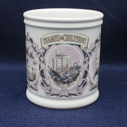 White ceramic mug with decorative purple design and text on a blue background