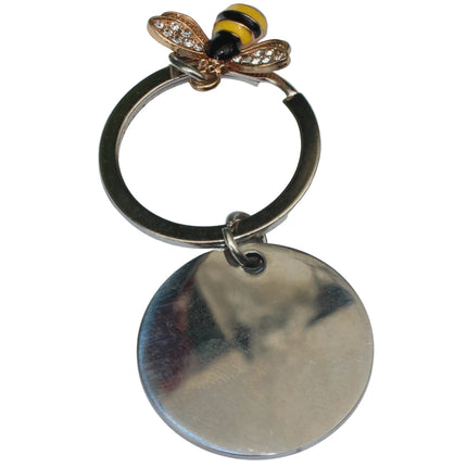 Metallic keychain with bee-shaped pendant on a white background