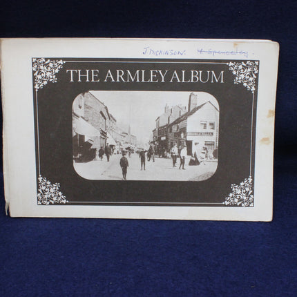Cover of 'The Armley Album' with a black and white photo of a street scene.