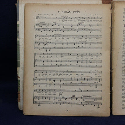 Sheet music for 'A Dream-Song' in an open book on a dark background