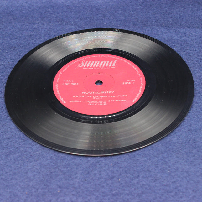 Danzig Philharmonic Orchestra – A Night On The Bare Mountain Vinyl record with a pink label on a blue surface