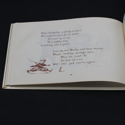 Open Gollywog book with text and illustrations on a black background
