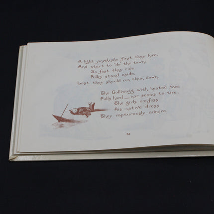 Open Gollywog book with text and a small illustration on a dark background