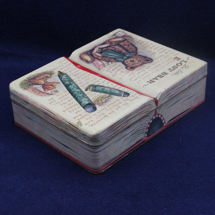 Open book with illustrations on a dark blue background