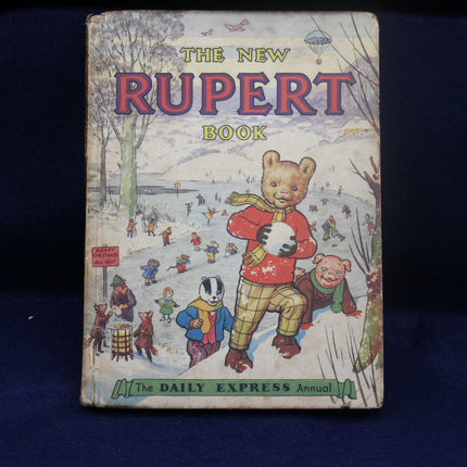 Vintage 'The New Rupert Book' on a dark blue background