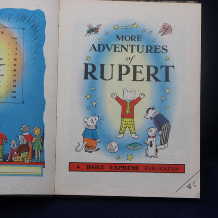 Book cover of 'More Adventures of Rupert' with Rupert Bear and friends on a blue background.