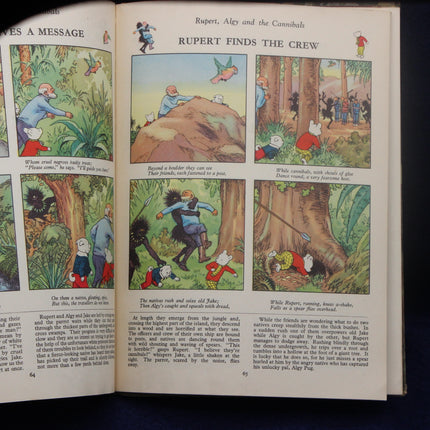 Open book with illustrated pages featuring Rupert Bear and friends in a forest setting.