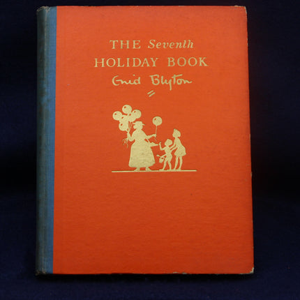 Orange book titled 'The Seventh Holiday Book' by Enid Blyton with a illustration of a woman and child on a dark background