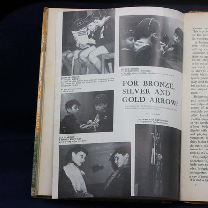 Open book with black and white photographs and text on a dark background