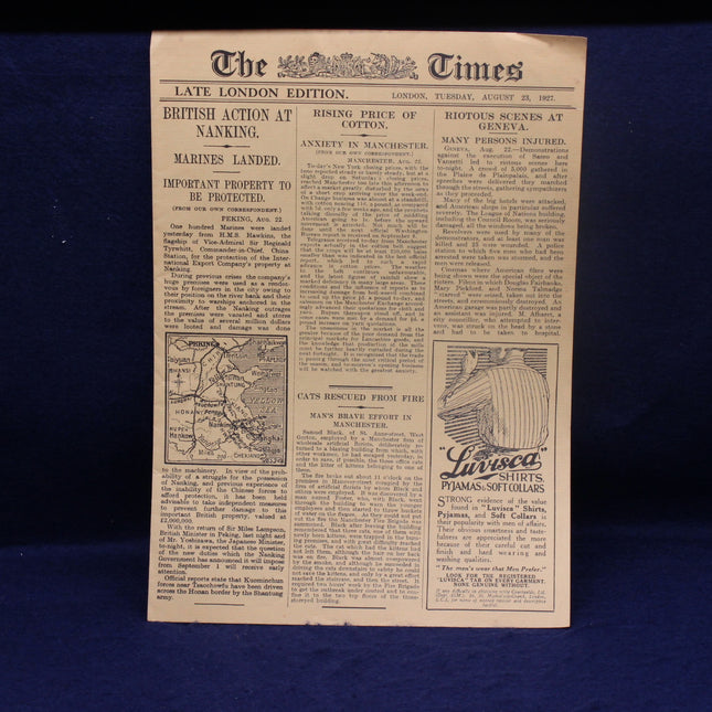 Vintage newspaper from 'The Times' with text and a map on a blue background