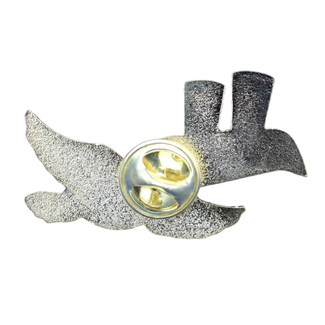 Metallic pin with wings on a blue textured background